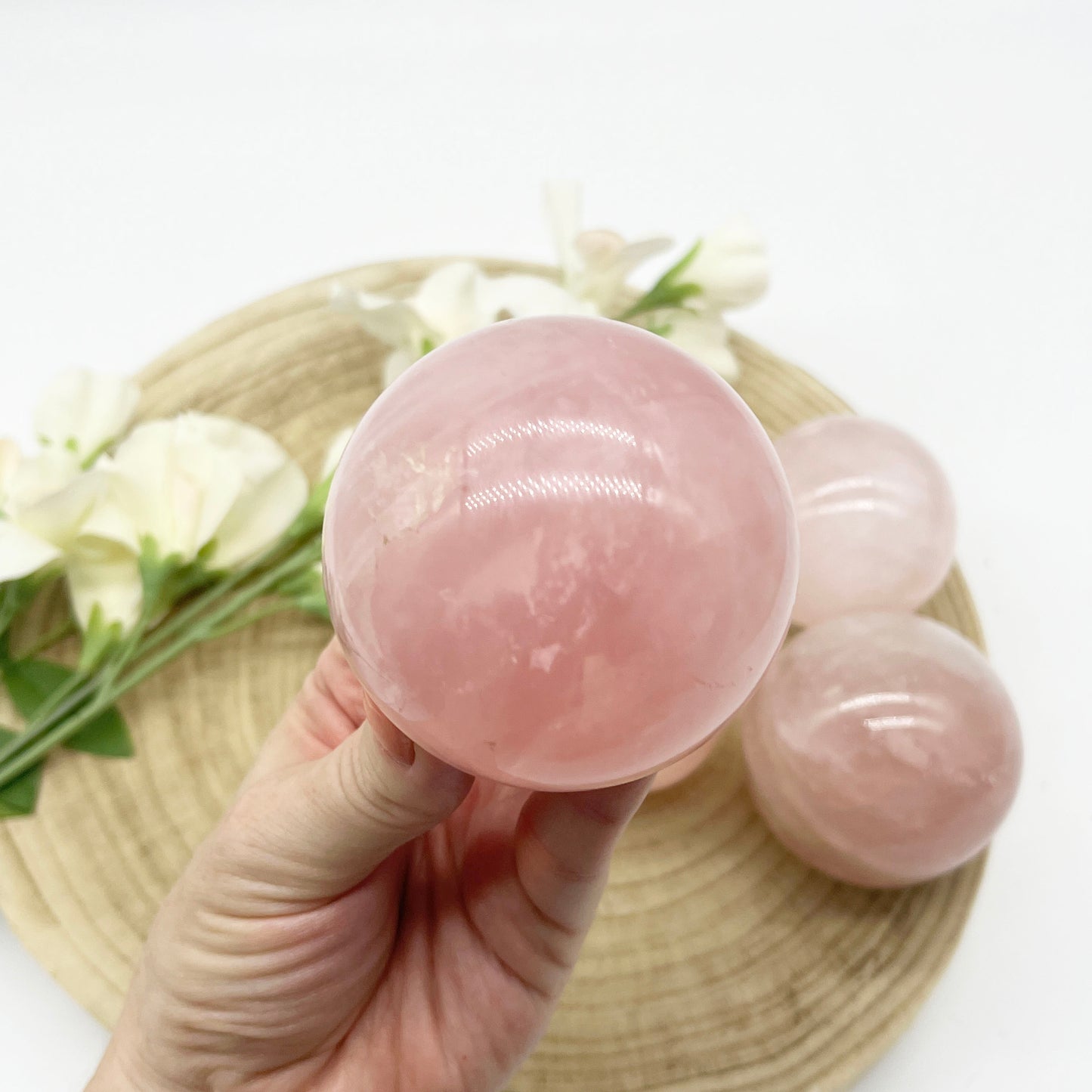 Rose quartz polished crystal sphere