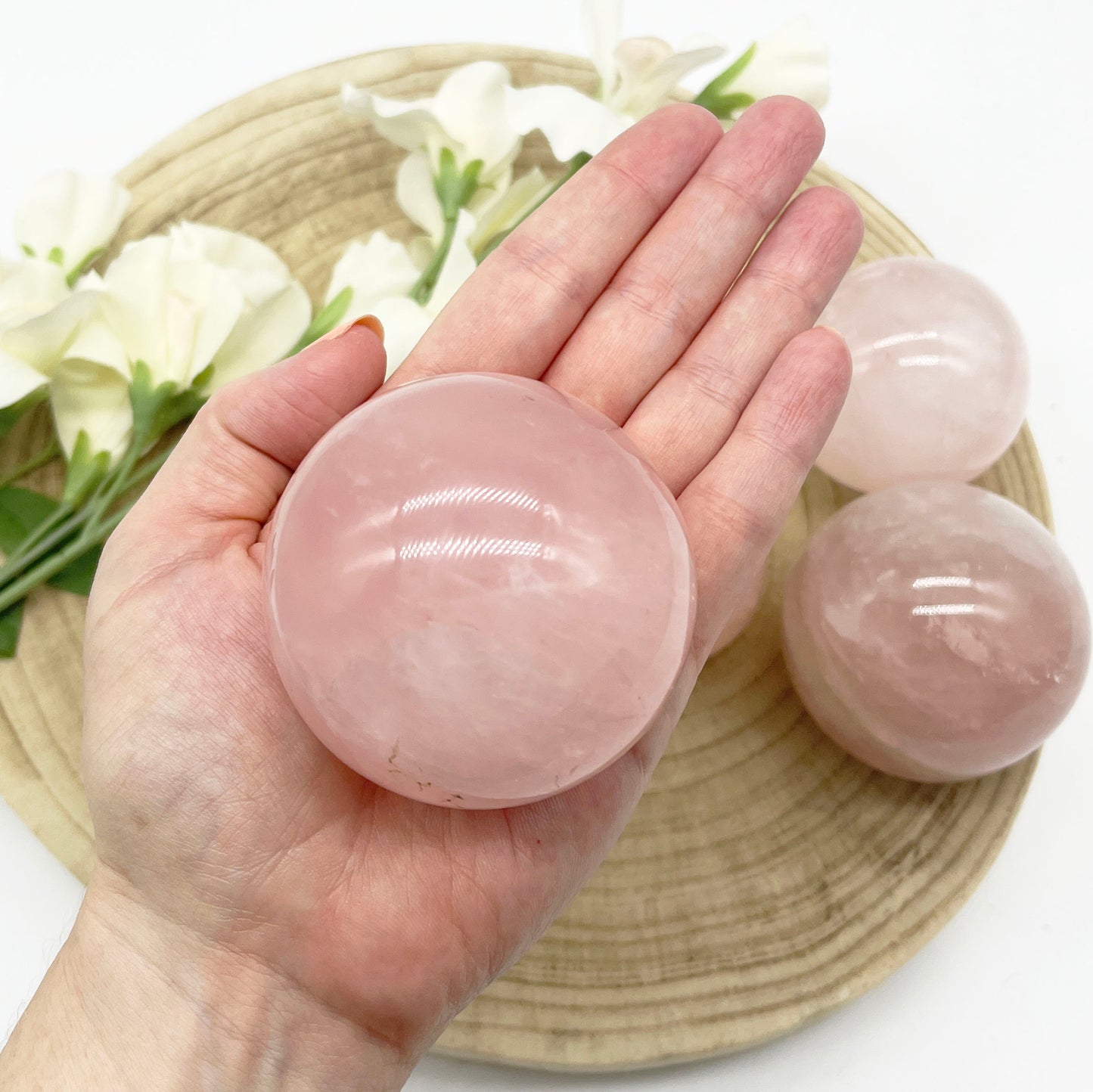 Polished sphere in rose quartz crystal