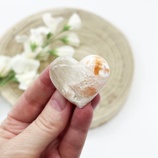 pink scolecite stone. Polished crystal heart