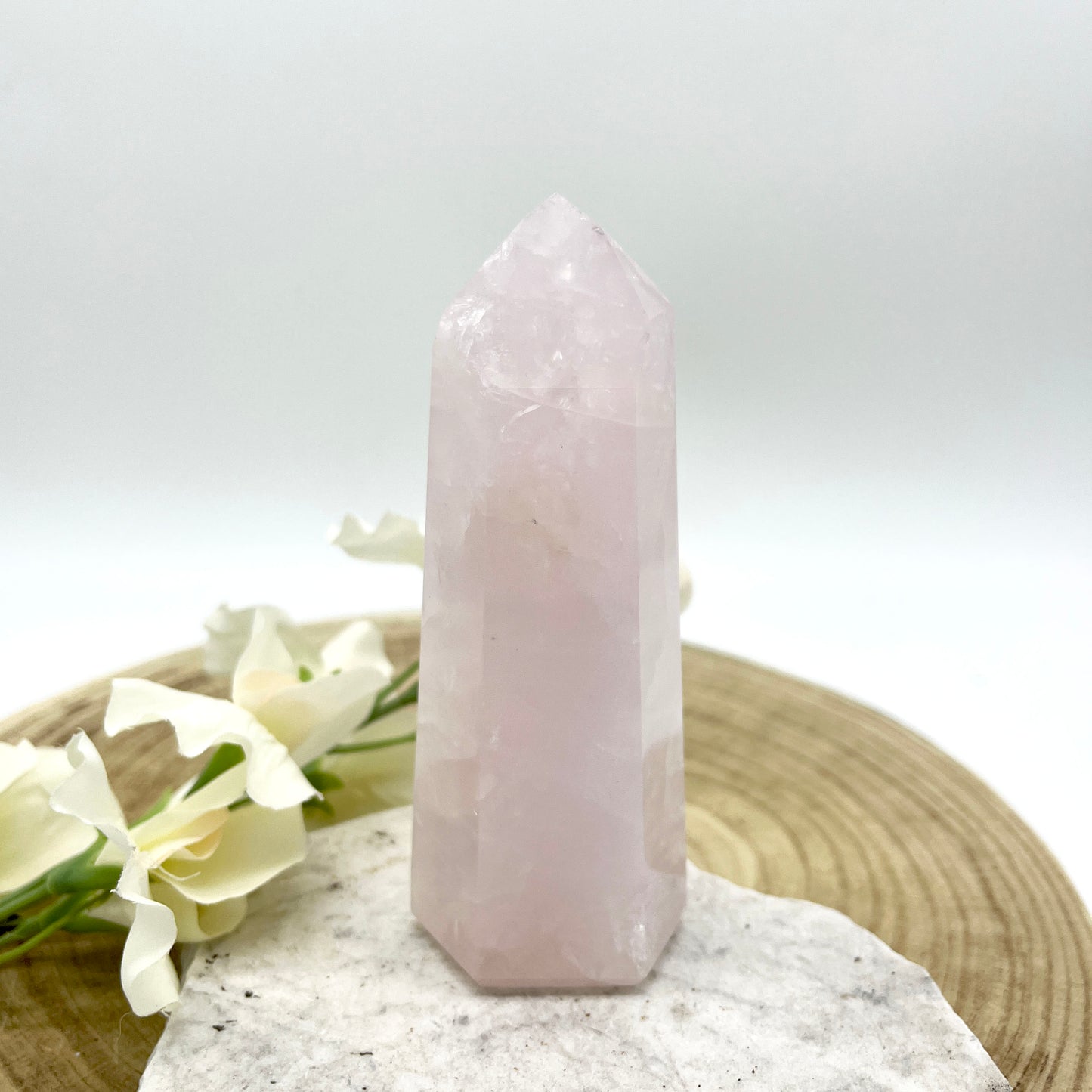 Rose quartz crystal generator polished point